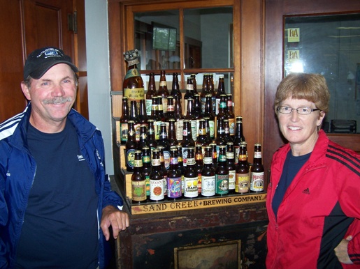 Faye and Joe with samples of beers brewed at Sand Creek Brewery in Black River Falls WI